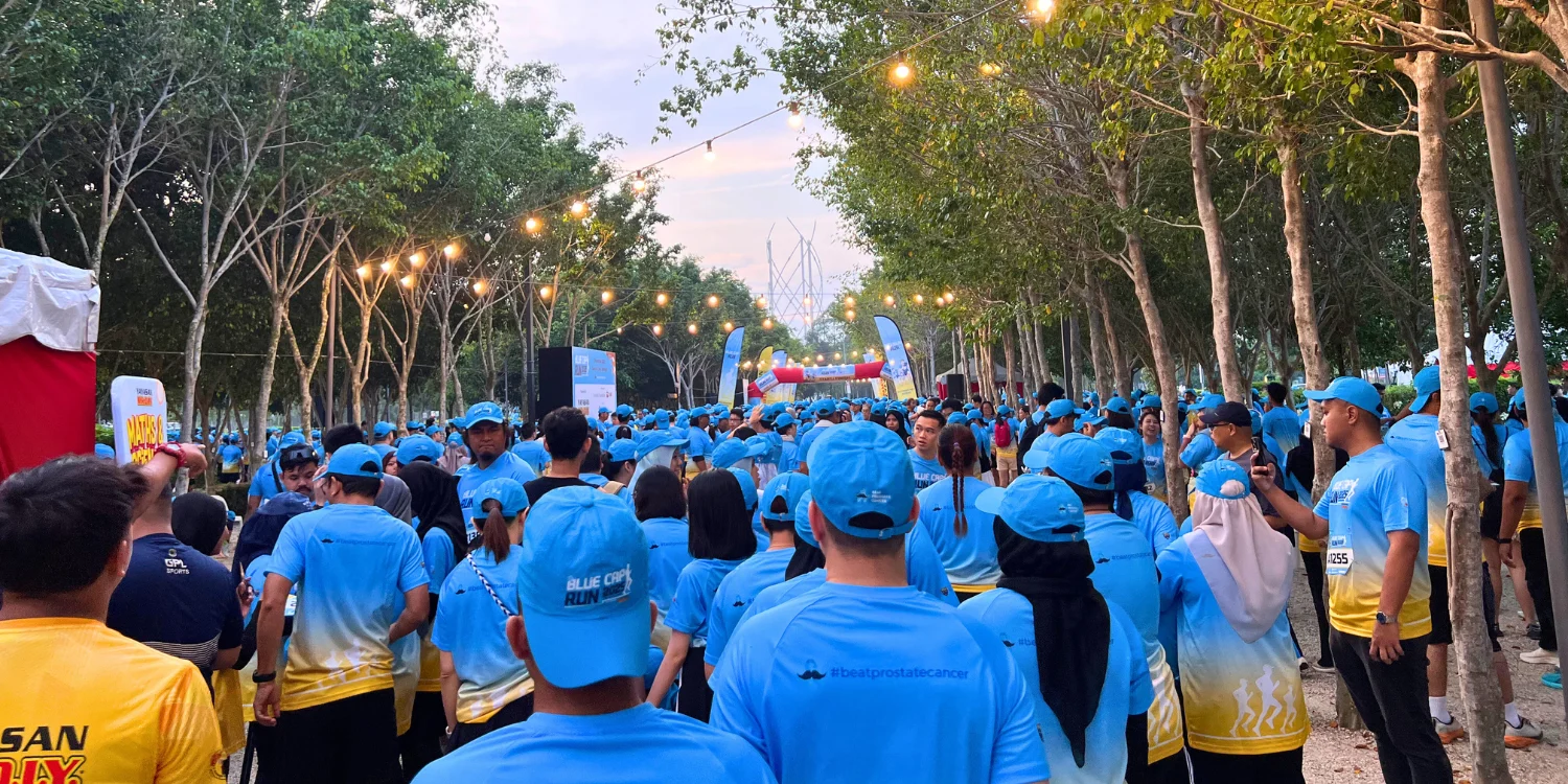 Large crowd of runners wearing blue shirts and cap at Blue Cap Run 2025 Large crowd of runners wearing blue shirts and cap at Blue Cap Run 2025