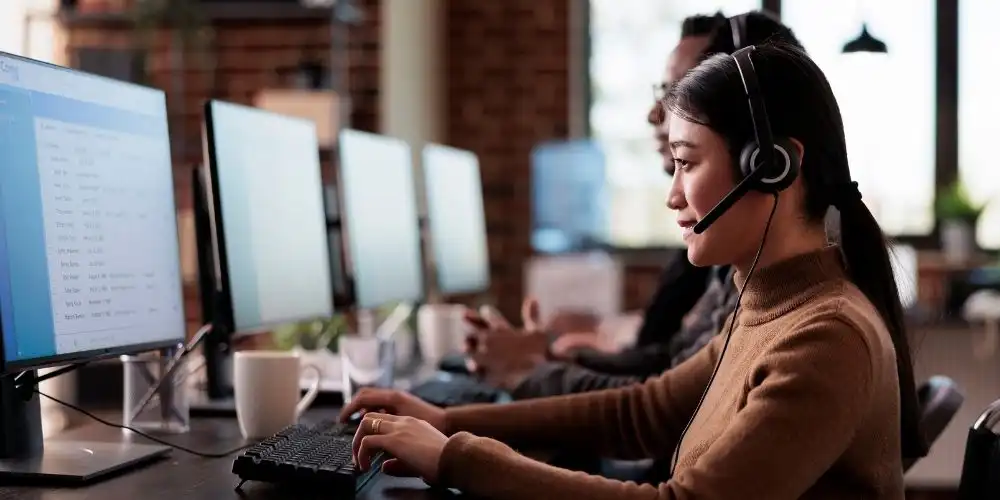 Business employee managing IT problems and system issues during a busy workday in the office